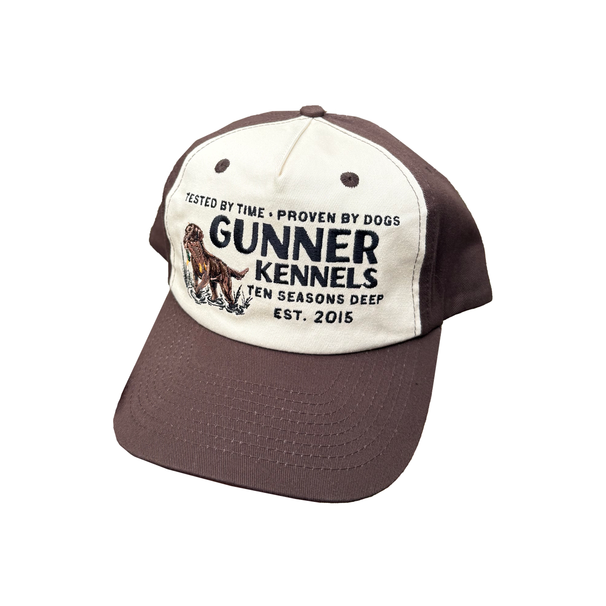 Show your love of dog protection and quality with the GUNNER Ten Seasons Deep Hat—a brown and white two-tone cap embroidered with a dog and “TESTED BY TIME • PROVEN BY DOGS, TEN SEASONS DEEP, EST. 2015.”.