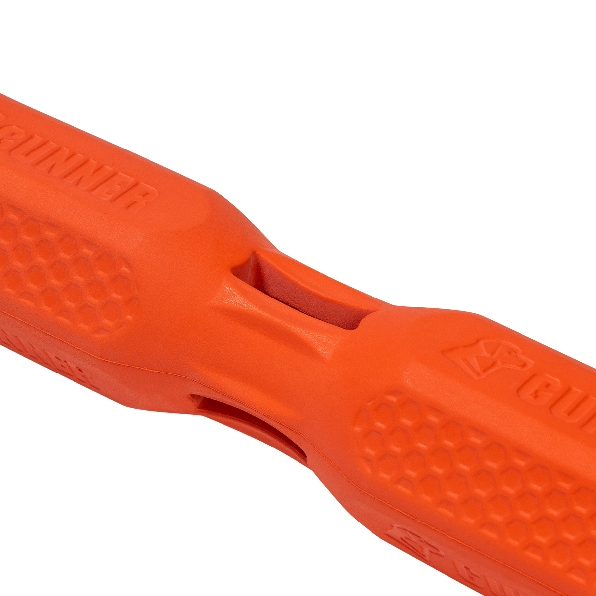 Close-up of the GUNNER BUMPER by GUNNER—a bright orange, textured rubber dog toy with a honeycomb pattern and central opening, designed to make playtime more engaging for you and your pet. Set against a white background.