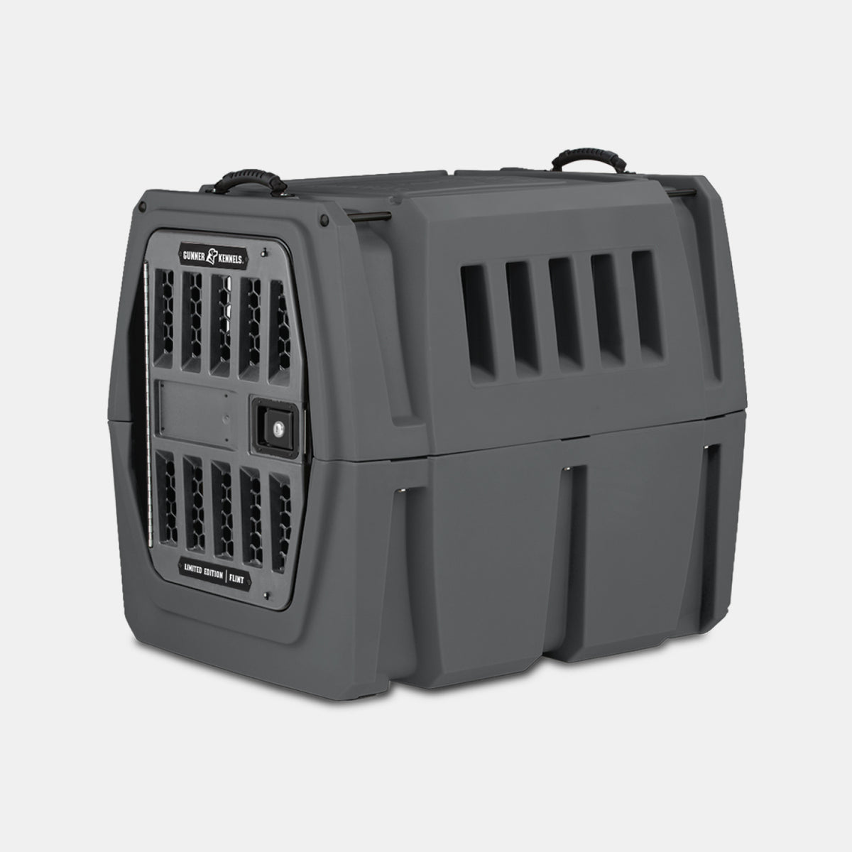 The GUNNER G1™ KENNEL - FLINT is a sturdy dark gray pet crate with vented sides and front, a secure grid door, and top handles for easy carrying—designed to provide top safety when transporting your pet.