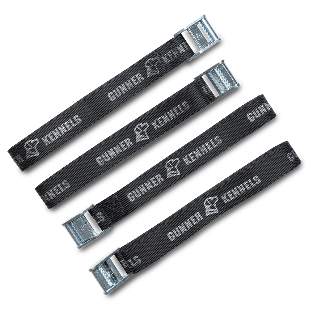 The GUNNER TIE-DOWN STRAP KIT includes four black straps with metal buckles, each featuring the GUNNER name and dog head logo—perfect for securing your crash test certified dog crate. Arranged parallel on a light gray background.
