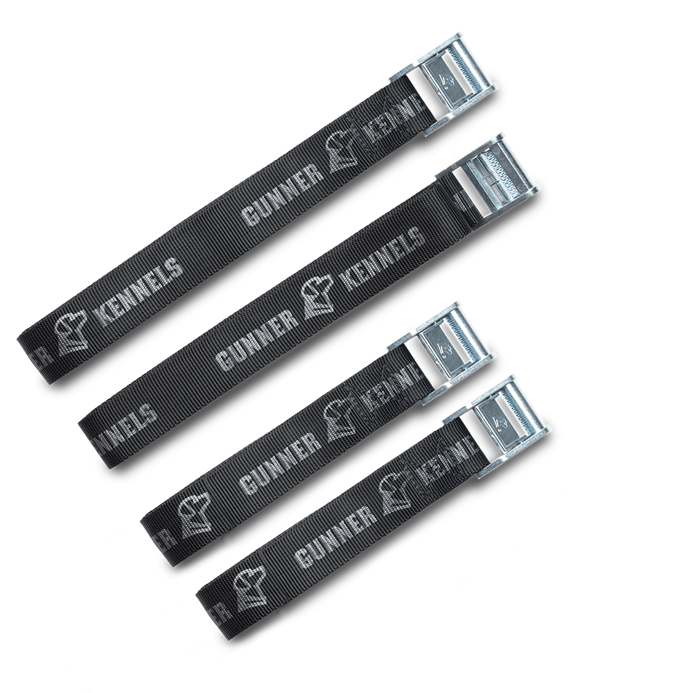 The GUNNER TIE-DOWN STRAP KIT includes four black nylon straps with metal buckles, each branded with GUNNER and the kennel logo in white—crash test certified and ideal for securing your dog crate. Shown on a white background.