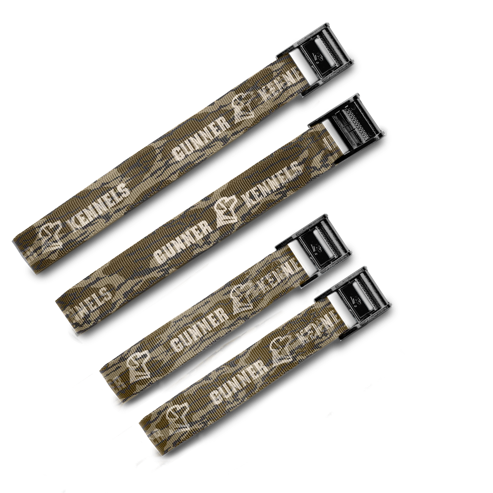 Four brown, adjustable nylon TIE-DOWN STRAPS from GUNNER, each with black metal buckles and the brand’s white logo and dog silhouette—perfect for securing your crate.