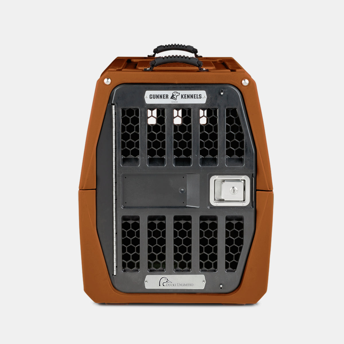 A brown and black portable dog crate with a metal door and handle on top, labeled Gunner Kennels and Ducks Unlimited, set against a plain white background—perfect for safely transporting your hunting dog.