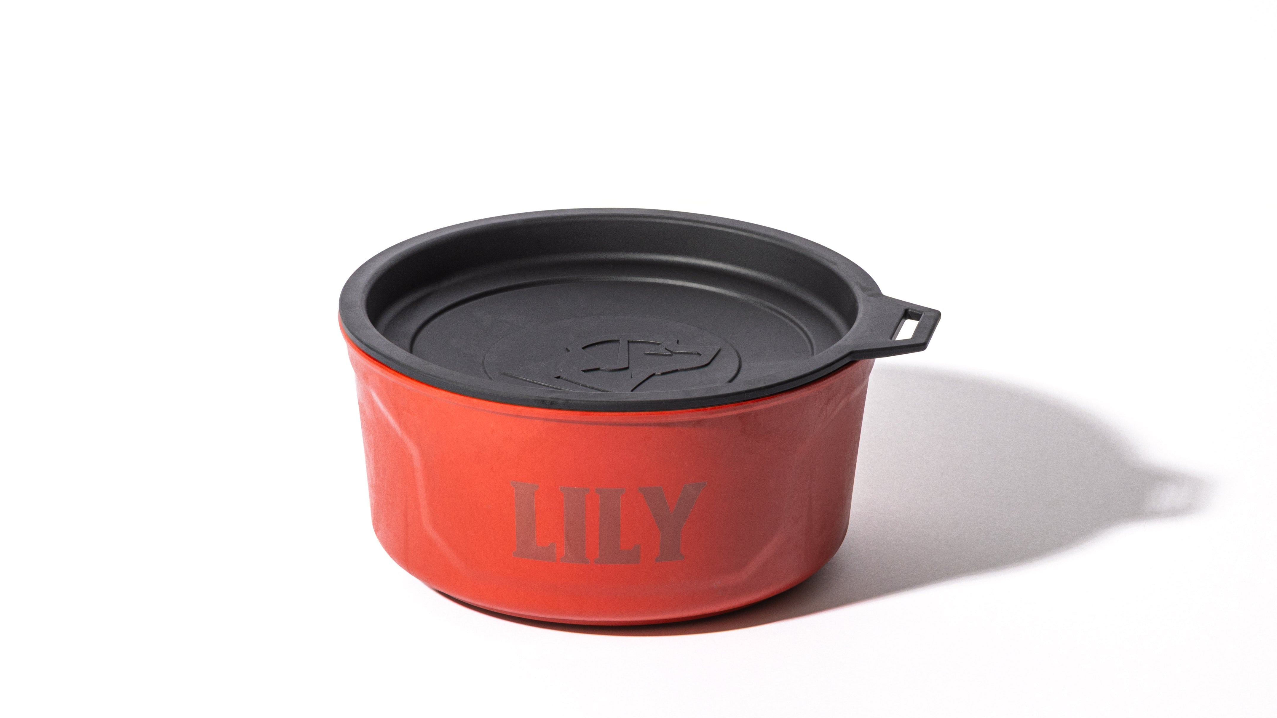 A red pet bowl labeled LILY with a black lid, photographed on a white background with a shadow to the right—perfect for your hunting dog’s kennel or dog crate.