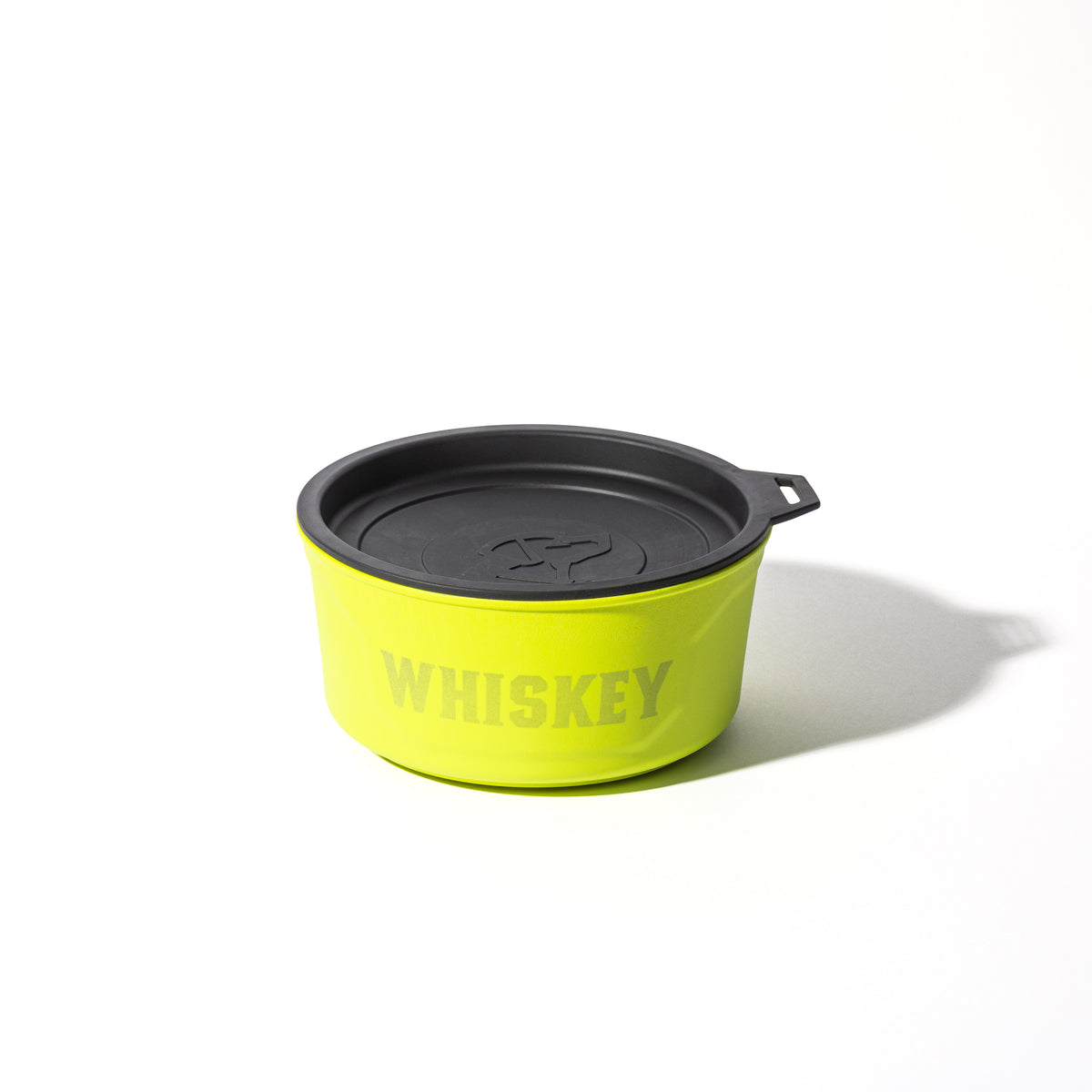 A round, yellow GUNNER dog bowl labeled SULPHUR SPRINGS, featuring a black lid and handle tab, sits on a white background—a distinctive limited-edition release from GUNNER.