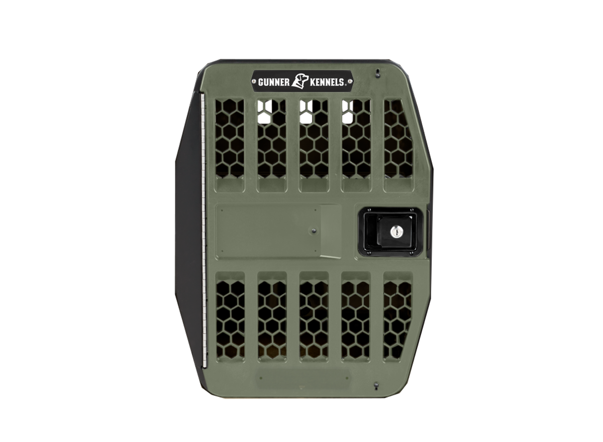 A GUNNER G1™ KENNEL DOOR GREEN dog crate is shown from the front, highlighting its sturdy door with a honeycomb ventilation pattern and secure lock.
