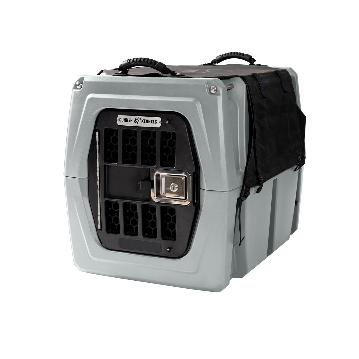 The GUNNER ALL-WEATHER KIT 2.0 BLACK is shown partially draped over a gray, hard-sided pet kennel featuring a secure metal door, ventilation holes, and top carrying handles; the black waterproof cover provides UV protection and is photographed on a white background.