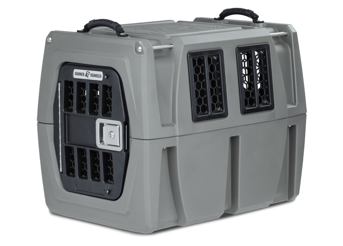 The GUNNER G1™ Kennel offers durable, double-wall protection with black mesh windows, a secure metal door, reinforced structure for shock safety, and top handles—making it one of the safest dog crates by GUNNER.
