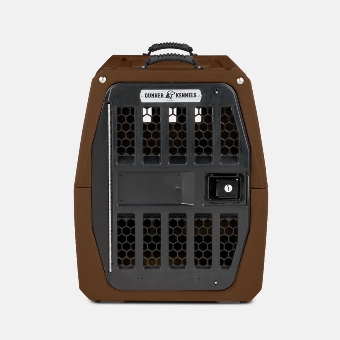 The GUNNER G1™ KENNEL - SUSQUEHANNA, a portable brown and black pet kennel from the Archive Series, features a metal door, ventilation holes, and top carrying handle for dog protection—shown on a plain white background.