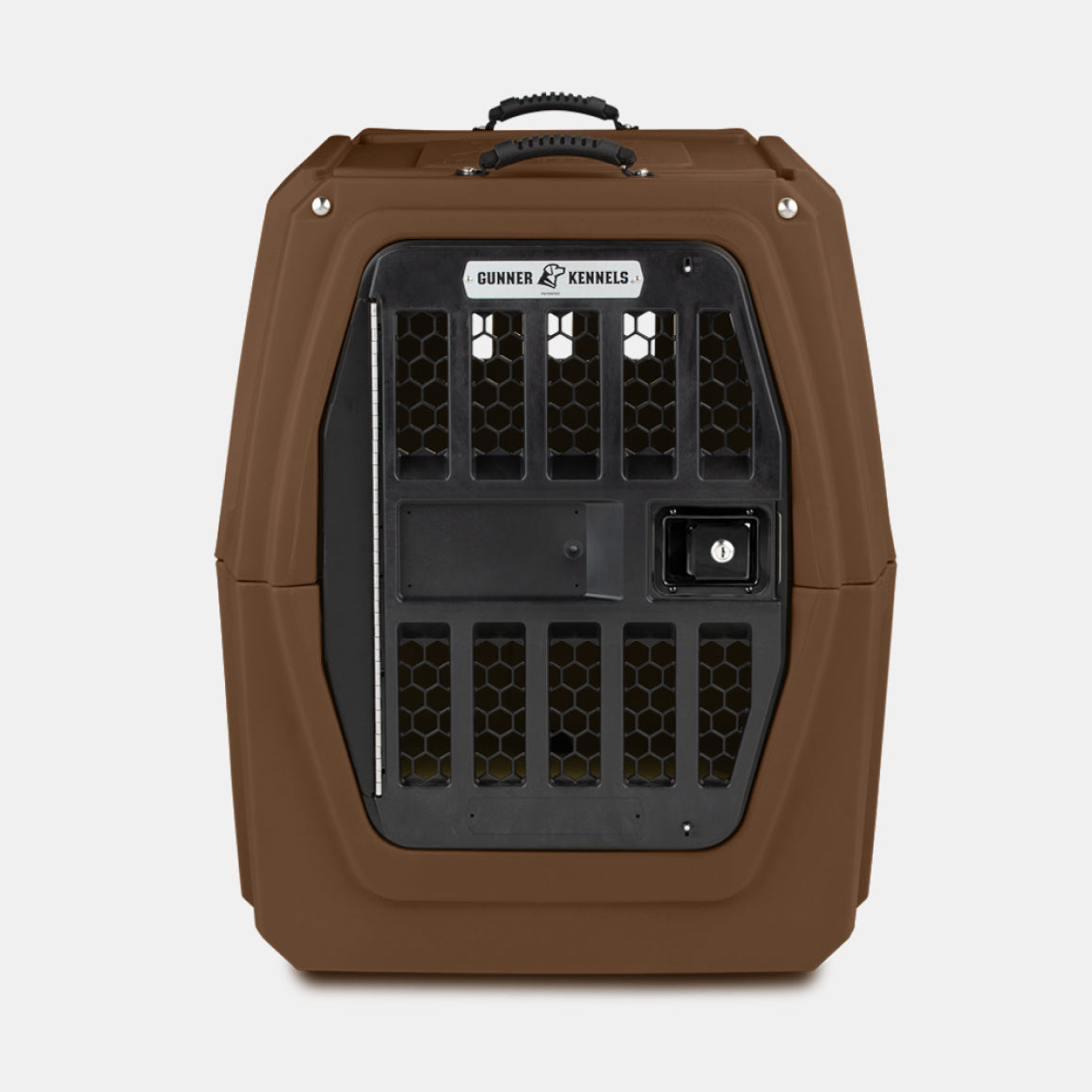 The GUNNER G1™ KENNEL - SUSQUEHANNA is a durable brown plastic pet crate with Flyway colors, black metal door, top handle, ventilation slots, and a GUNNER Archive Series label above the door. Designed to protect dogs; background is plain white.