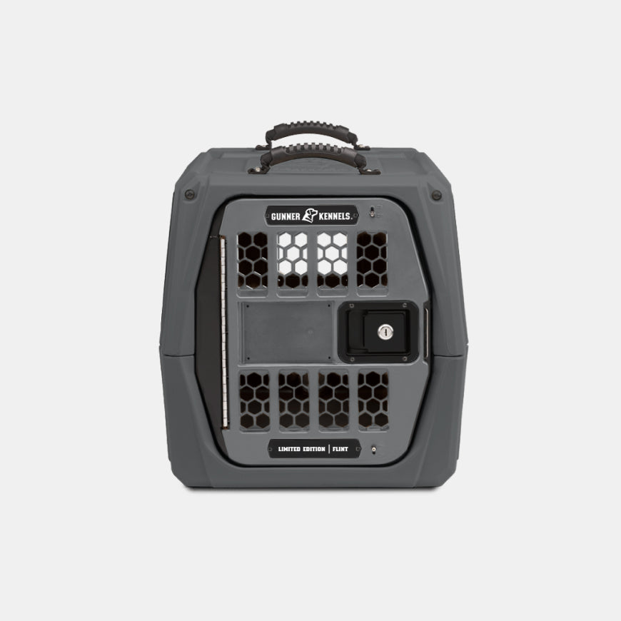 Gray Gunner Kennels dog kennel with a handle on top and a ventilated front door, perfect for your hunting dog or as reliable outdoor gear, shown against a plain white background.