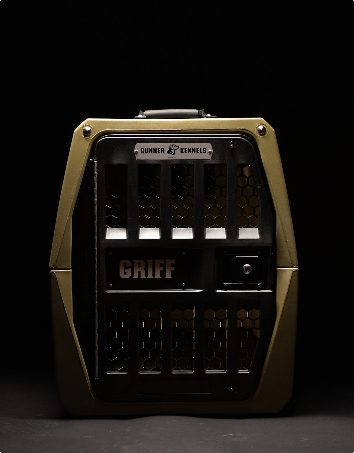 A sturdy, olive-green dog crate with black metal bars and the name GRIFF on the front, this kennel features the Gunner Kennels logo on a dark background—perfect for securing your hunting dog in style.