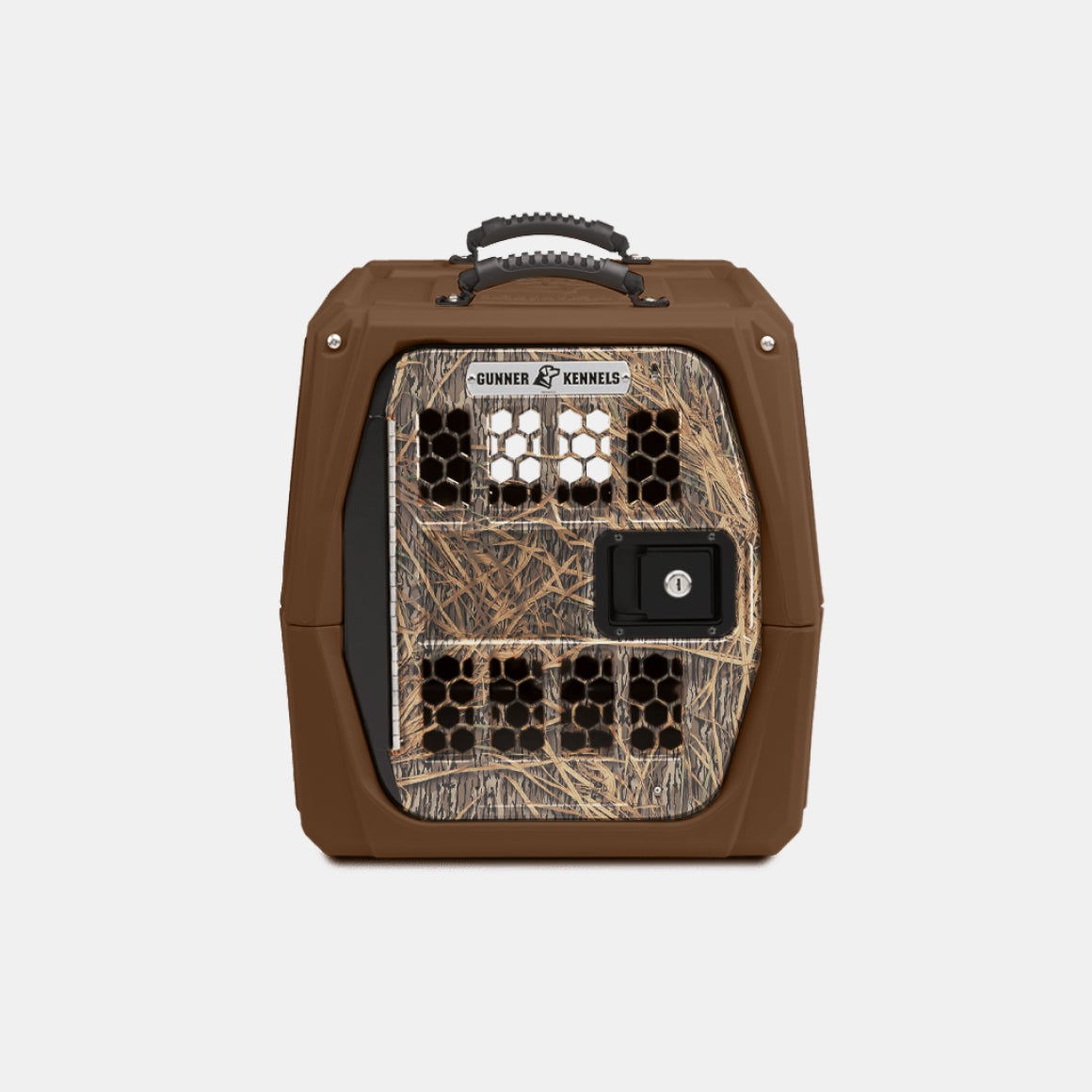 The GUNNER G1™ KENNEL - SUSQUEHANNA/MOSSY OAK SHADOW GRASS features a Mossy Oak pattern door, black top handle, hexagonal vents, secure lock, and Gunner branding—ideal for duck hunters.