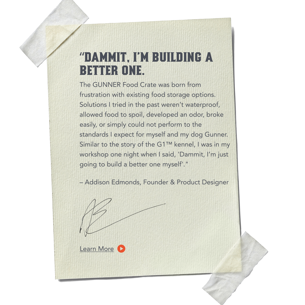 A textured sheet of paper is taped at the corners with masking tape. The paper features a printed message about building a better dog crate, attributed to Addison Edmonds, with a signature and a Learn More link at the bottom.