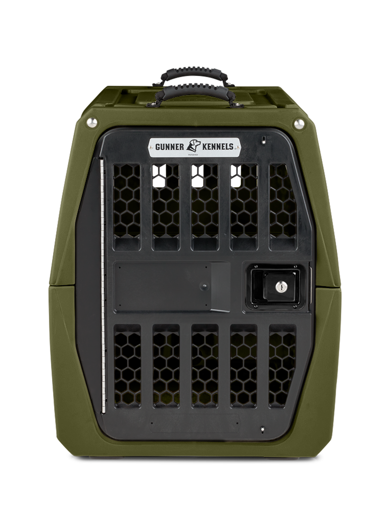 A sturdy, olive green dog kennel with a handle on top, a secure black metal door with hexagonal ventilation holes, and a Gunner Kennels label above the door—ideal for your working dog.