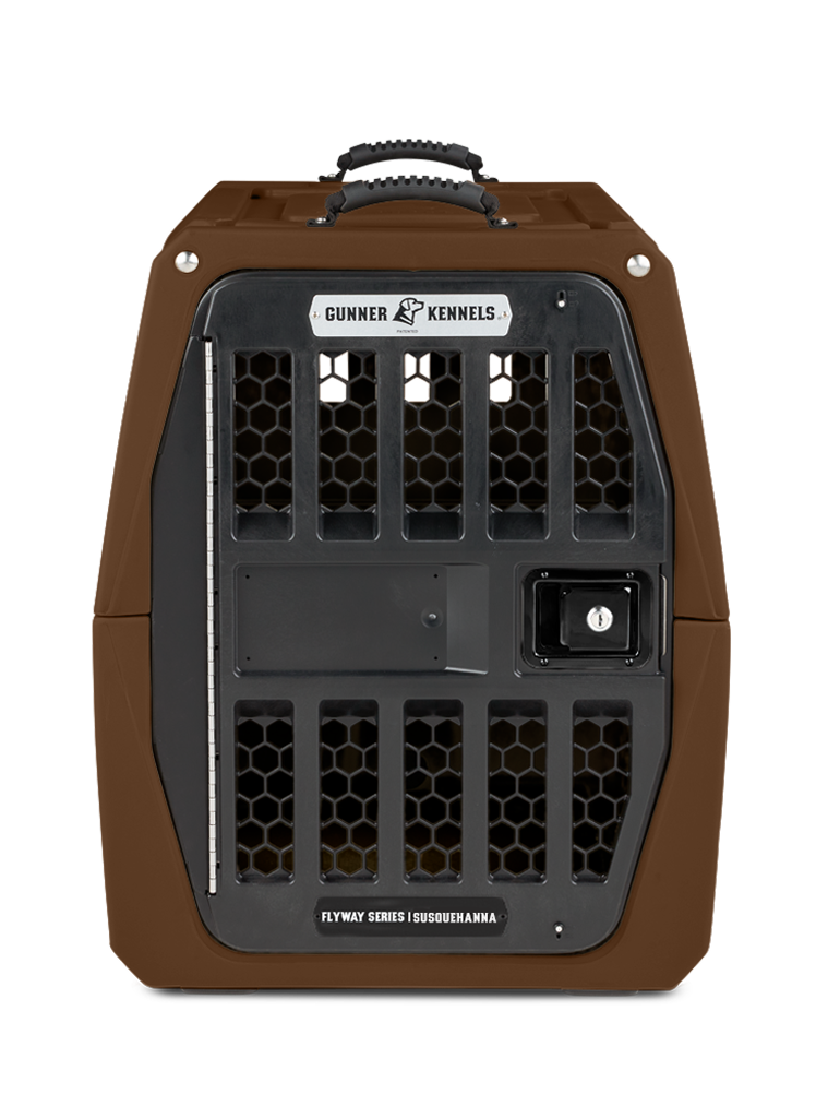 A sturdy, brown dog kennel with a black metal door, honeycomb ventilation holes, top handle, and a GUNNER KENNELS label. This dog crate is designed for secure transportation—perfect for your hunting dog.