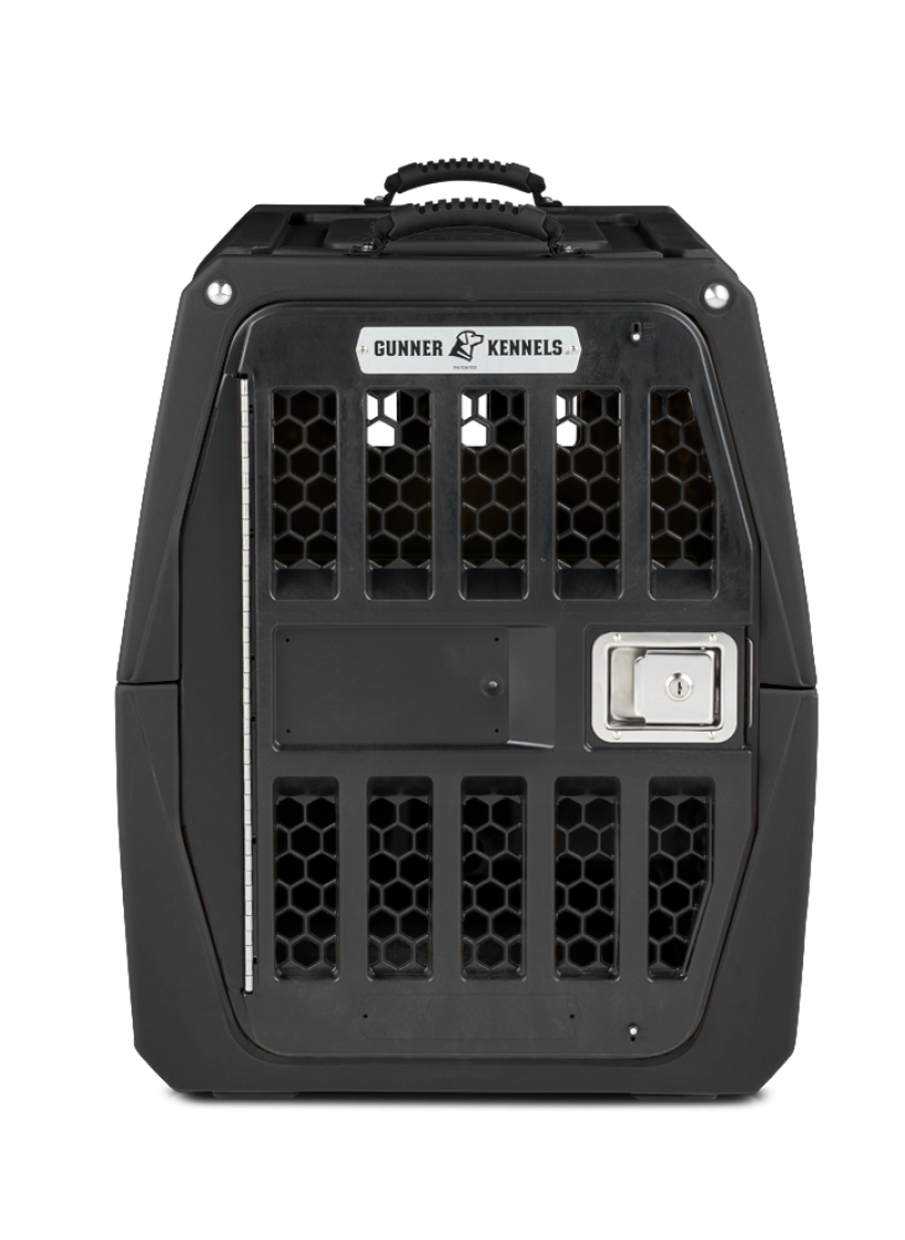 A sturdy black dog crate with a metal door and honeycomb-style ventilation holes. The label on top reads “Gunner Kennels,” and there is a handle and latch for secure closure—ideal outdoor gear for your working dog.
