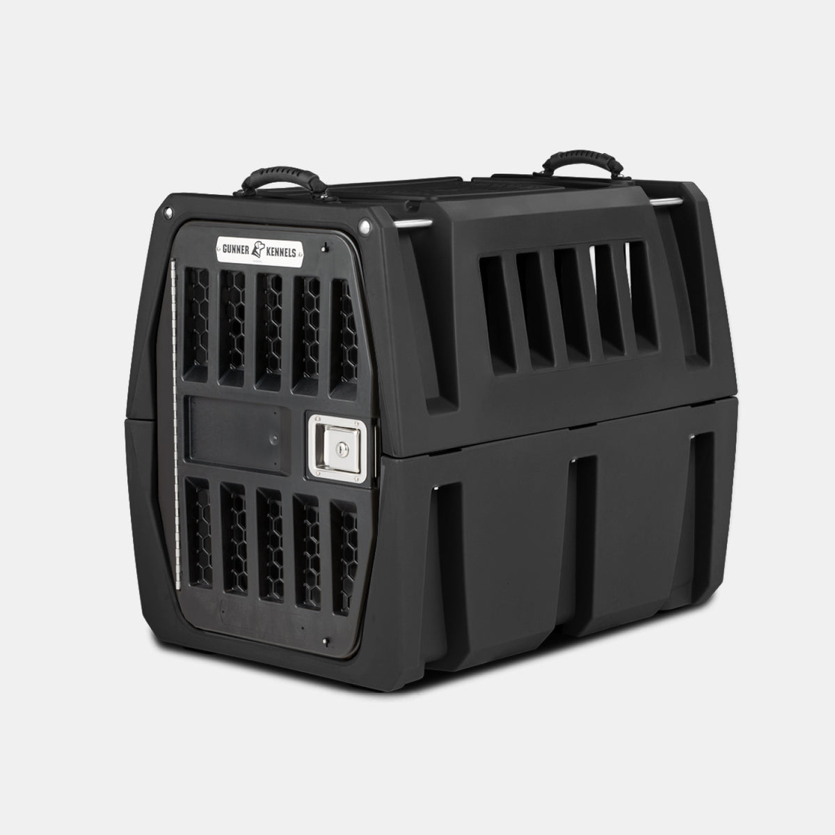 The GUNNER G1™ KENNEL - BLACK is a tough dog crate with sturdy black plastic, a metal mesh door, side ventilation slats, top carrying handles, a secure latch, and reinforced design—ideal for safe pet travel or transport.