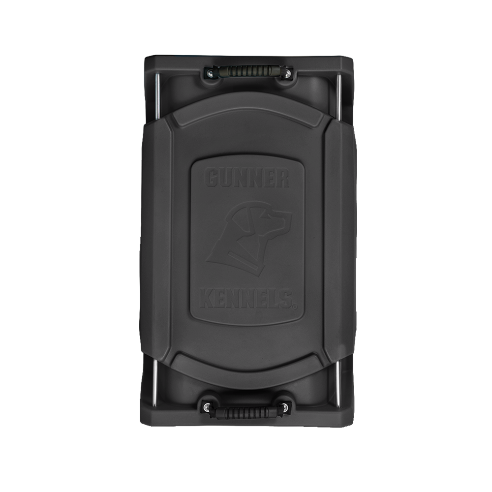 The GUNNER G1™ KENNEL - BLACK is a heavy-duty dog crate with sturdy end handles and an embossed dog head plus GUNNER KENNELS branding on the lid—a rugged, secure choice for your pet.