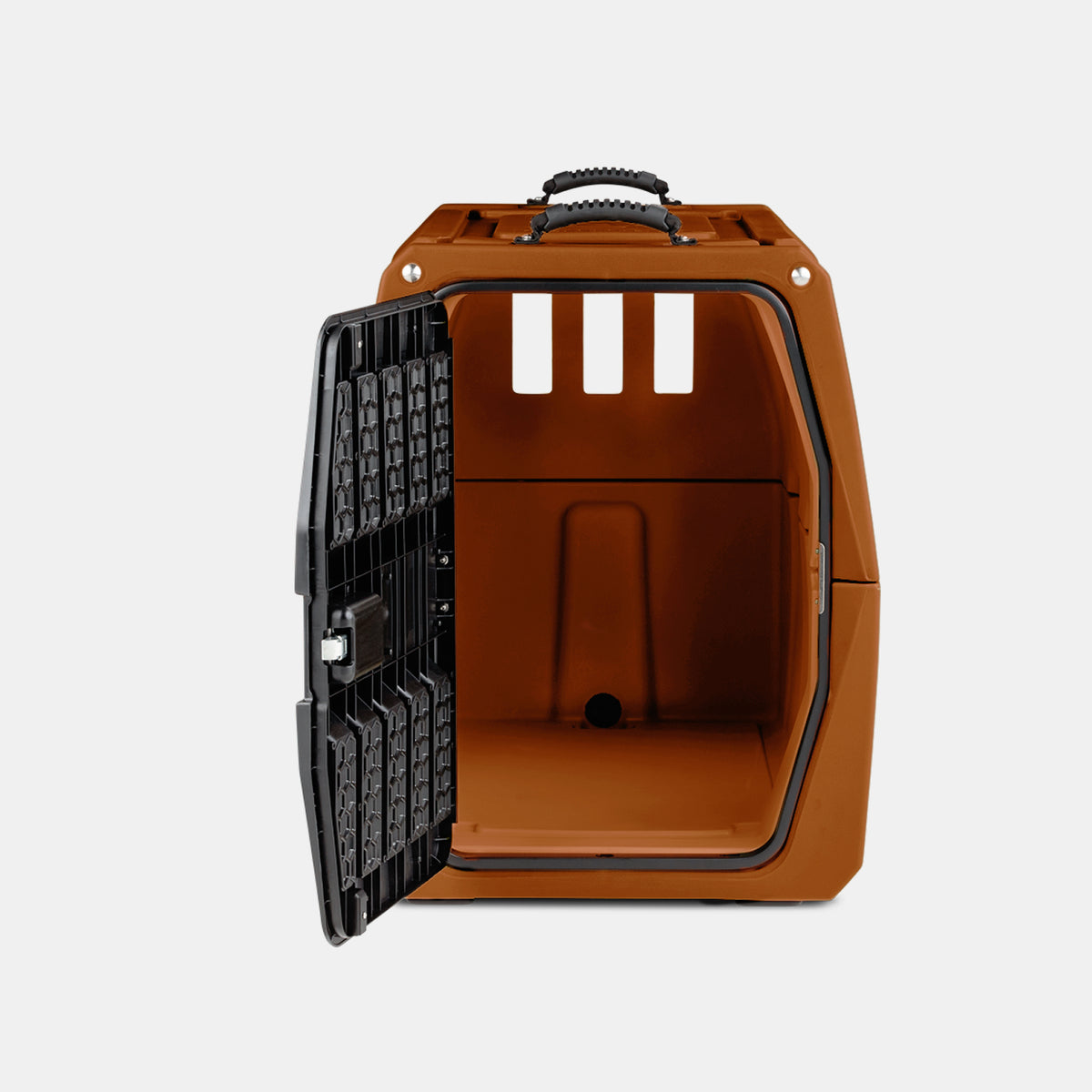 A brown plastic pet carrier with a black metal door open, showing the empty interior. Resembling a compact dog crate, the carrier has ventilation slots and a handle on top, set against a plain light background.