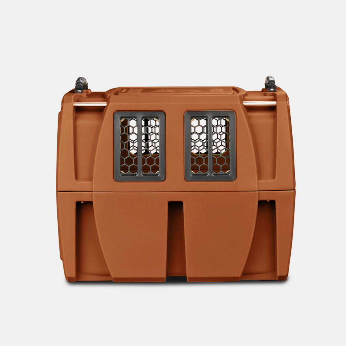 A brown plastic pet carrier, perfect as a compact dog kennel, with a front metal grate and ventilation windows, viewed from the front, against a plain white background.