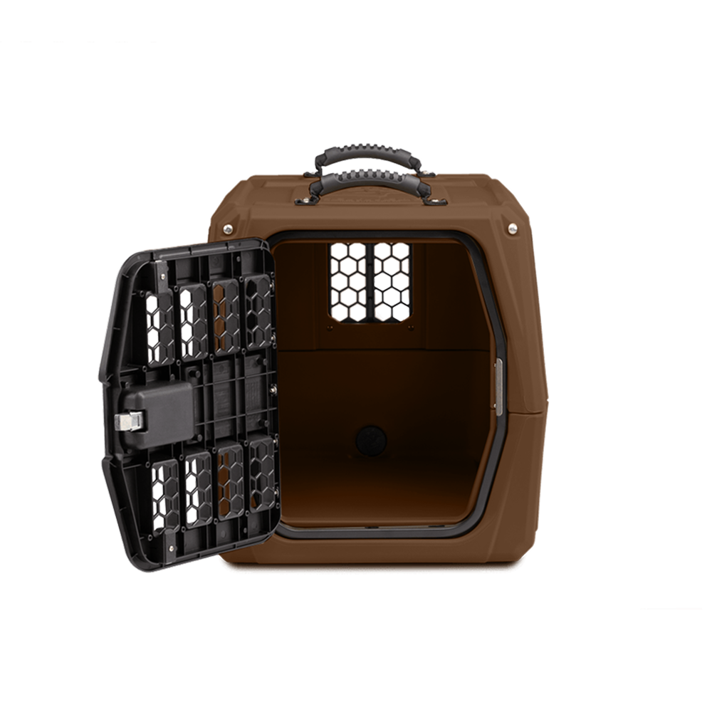 The GUNNER G1™ KENNEL - SUSQUEHANNA/MOSSY OAK SHADOW GRASS is a hard-sided pet carrier with a black metal door open, revealing its empty interior and rear ventilation window, ideal for duck hunters, shown on a white background.