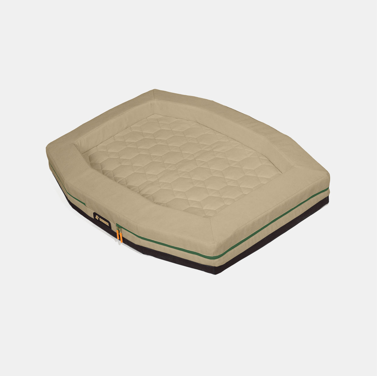 The GUNNER HOMESTEAD DOG BED Quail Tan is a rectangular pet bed with raised edges, a quilted center, green zipper, and side handle. This special-edition item brings comfort and style to your pet’s space against a plain white background.