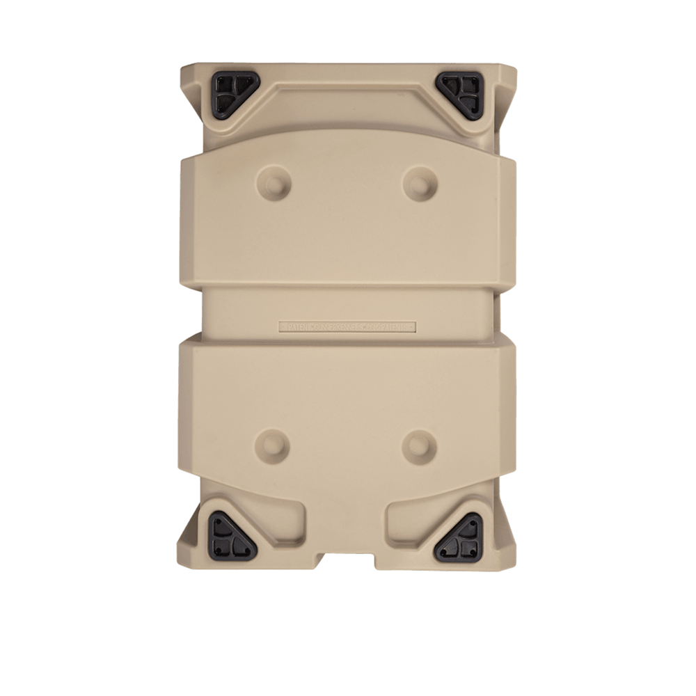 The GUNNER G1™ KENNEL - MOSSY OAK BOTTOMLAND TAN is a tan, rectangular hard plastic dog crate with black reinforced corner protectors, shown from above on a white background.