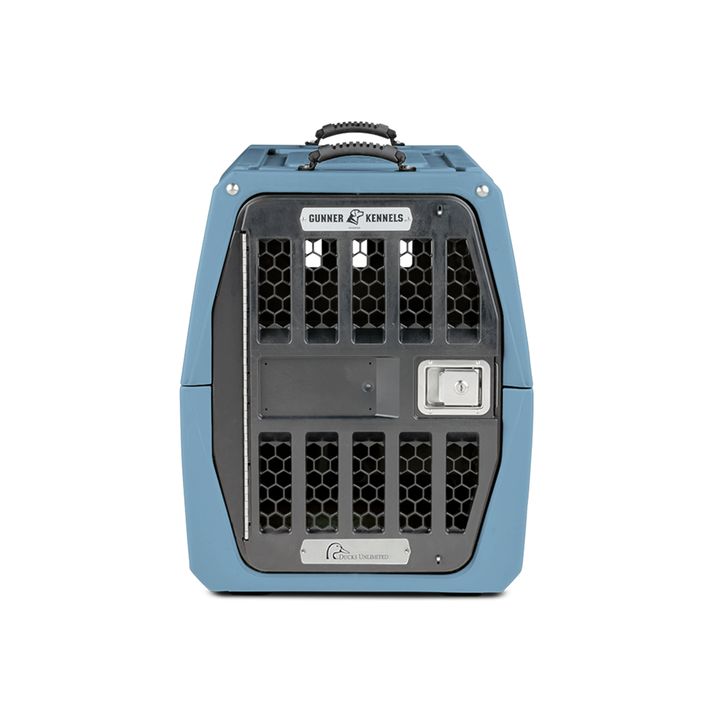 The GUNNER G1™ KENNEL - Ducks Unlimited Blue features a secure metal door, ventilation holes, a sturdy handle, and branding—ideal for waterfowl habitats—and is shown against a plain white background.