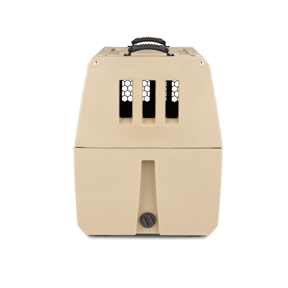 The GUNNER G1™ KENNEL - MOSSY OAK BOTTOMLAND TAN is a beige plastic dog crate with a black handle and three front ventilation slits, designed for safety, shown against a plain white background.