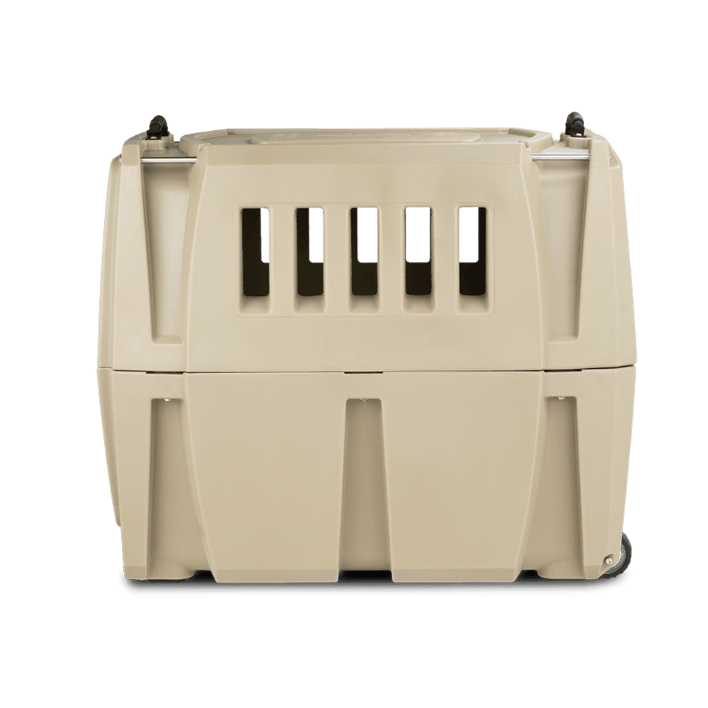 The GUNNER G1™ KENNEL - MOSSY OAK BOTTOMLAND TAN is a durable beige dog crate with ventilation slots and a top handle, shown from the front on a white background.