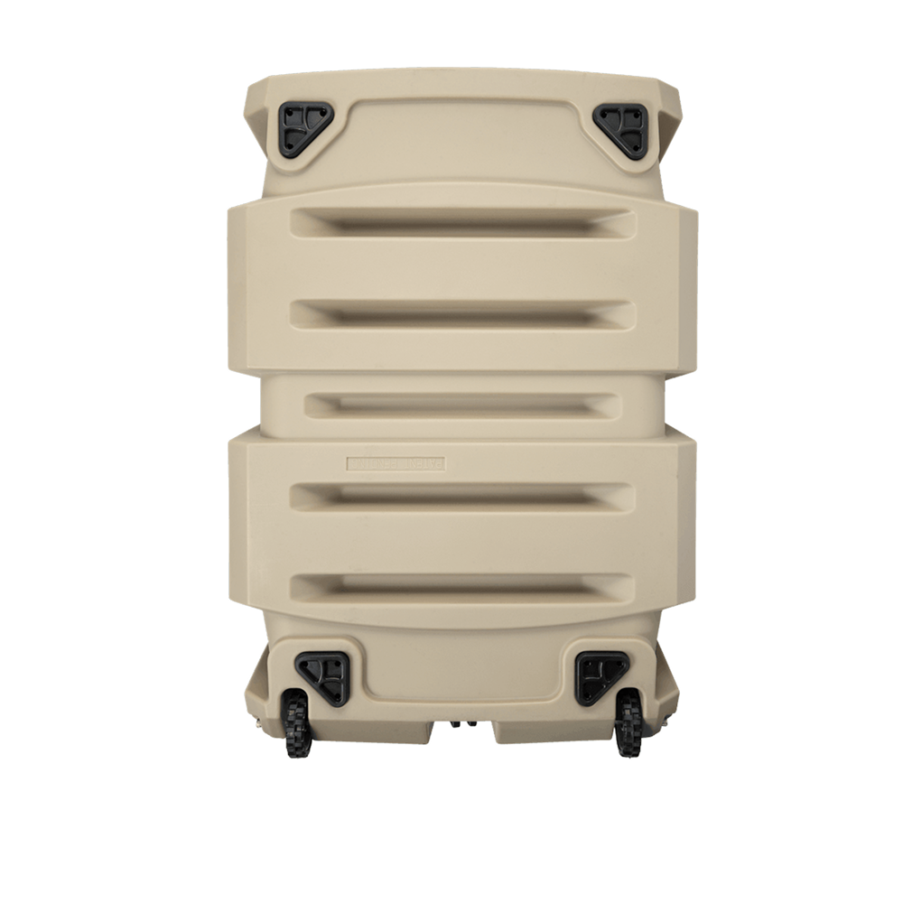 The GUNNER G1™ KENNEL - MOSSY OAK BOTTOMLAND TAN is a durable tan dog crate with three horizontal grooves, reinforced corners, four black latches, and two small wheels. Shown standing upright against a white background.