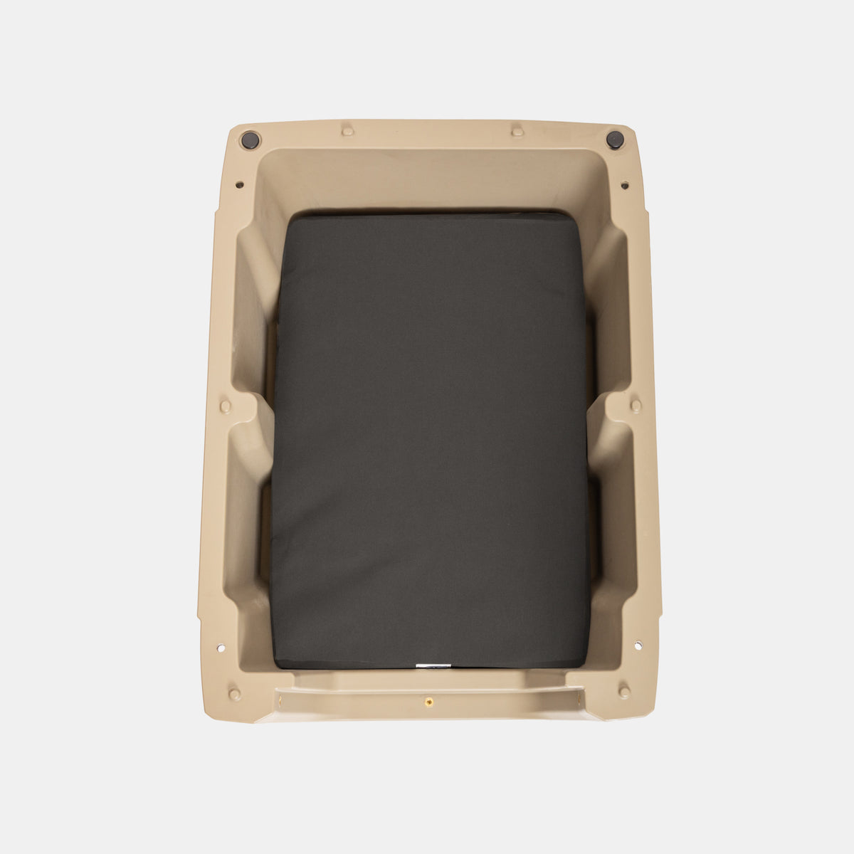 Rectangular pet door with a black interior on a beige frame against a white background