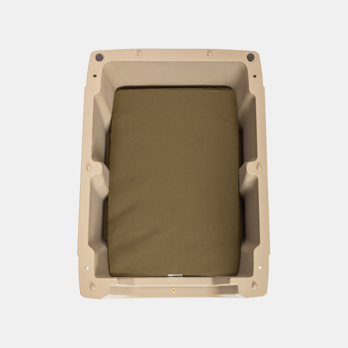 The GUNNER LONG HAUL BED is a tan rectangular plastic kennel bed with rounded corners and an olive green padded cushion, shown from above on a white background. Durable and easy to clean, its designed for lasting comfort for your dog.