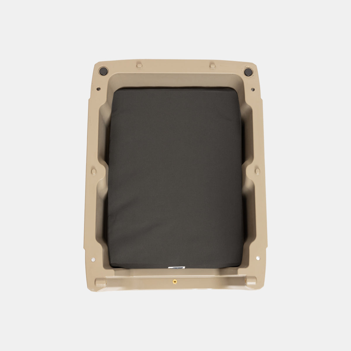 The GUNNER LONG HAUL BED features a rectangular tan plastic frame with a black padded cushion in the center, creating a durable dog bed, as seen from above on a plain white background.