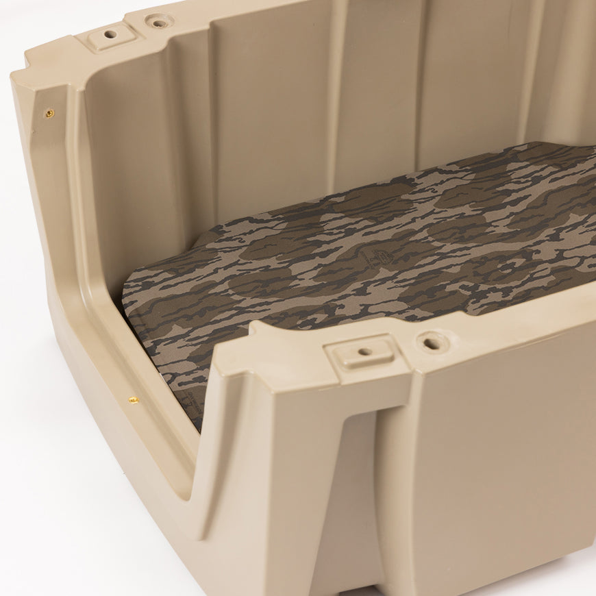 Beige plastic dog crate with a camouflage-patterned cushion inside, shown from an angled top view against a white background—perfect for use as reliable outdoor gear or a comfortable dog kennel.