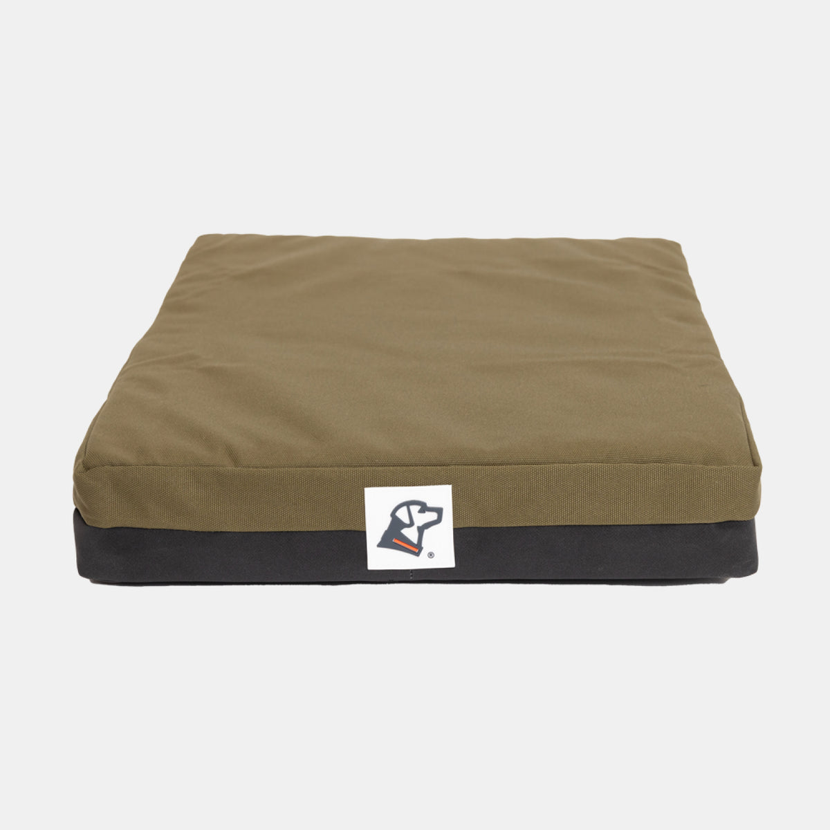 A square, olive green and black dog bed cushion designed to fit perfectly in a dog crate, featuring a small logo patch with a dog’s head on the front center. The background is plain white.