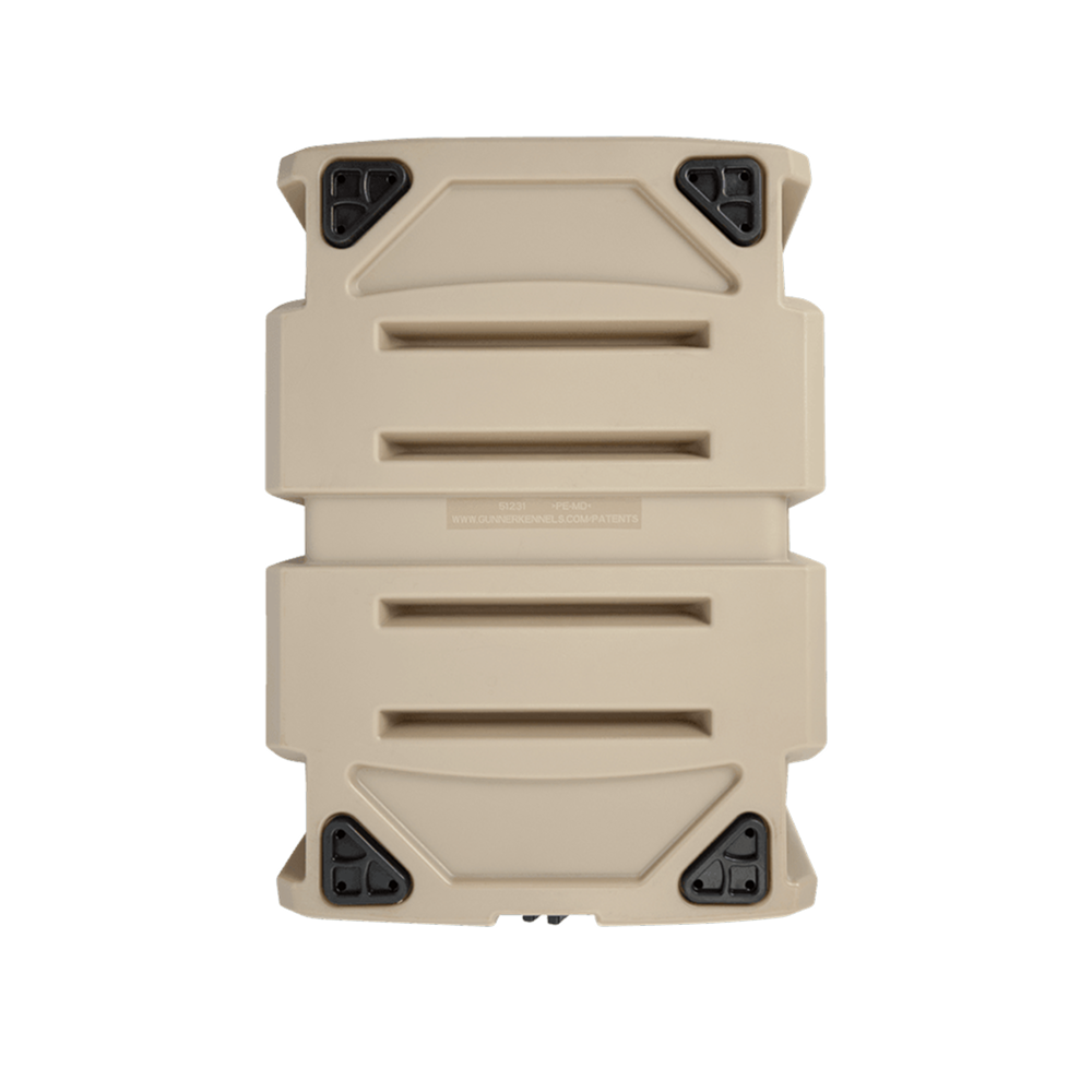 The GUNNER G1™ KENNEL - MOSSY OAK BOTTOMLAND TAN is a tan, rectangular hard-shell case with black reinforced corners, ridged surface, and horizontal grooves, photographed on a plain white background.