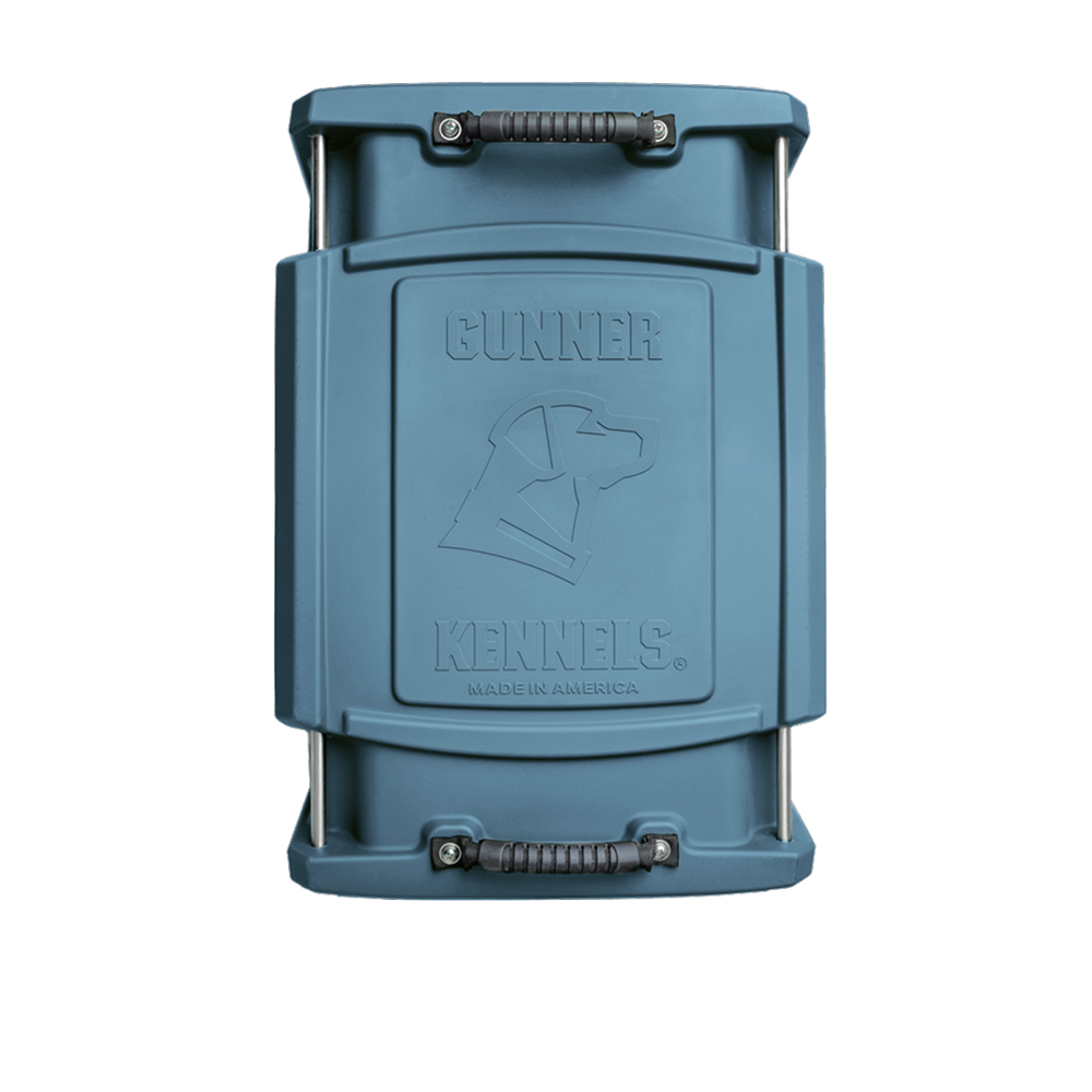 The GUNNER G1™ KENNEL - Ducks Unlimited Blue is a rectangular kennel with top and bottom handles, an embossed dog head, and Gunner Kennels Made in America reflecting quality and Ducks Unlimited’s habitat commitment.