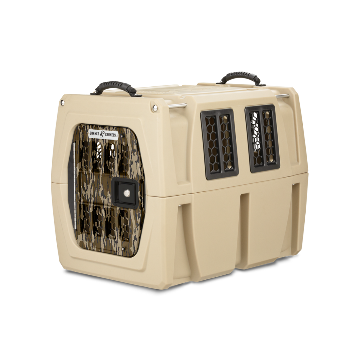 The GUNNER G1™ KENNEL - MOSSY OAK BOTTOMLAND TAN is a tan dog crate with black handles, a camouflage metal mesh door, and side ventilation windows, shown on a white background.