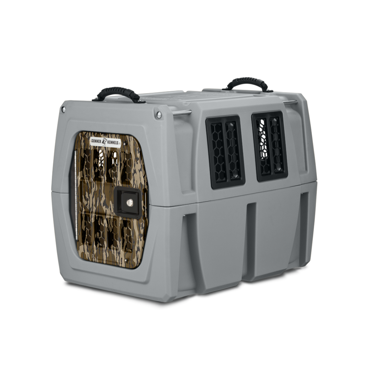 The GUNNER G1™ KENNEL - MOSSY OAK BOTTOMLAND GUNMETAL is a tough, gray plastic dog crate with dual black handles, side ventilation windows, and a camo metal-barred locking door—ideal for safe travel with your pet.