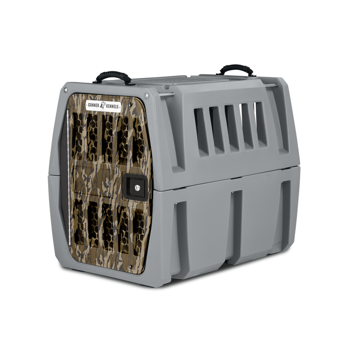 The GUNNER G1™ KENNEL – MOSSY OAK BOTTOMLAND GUNMETAL is a durable gray plastic dog crate with camouflage front door, side ventilation slats, and two black top handles for easy carrying.