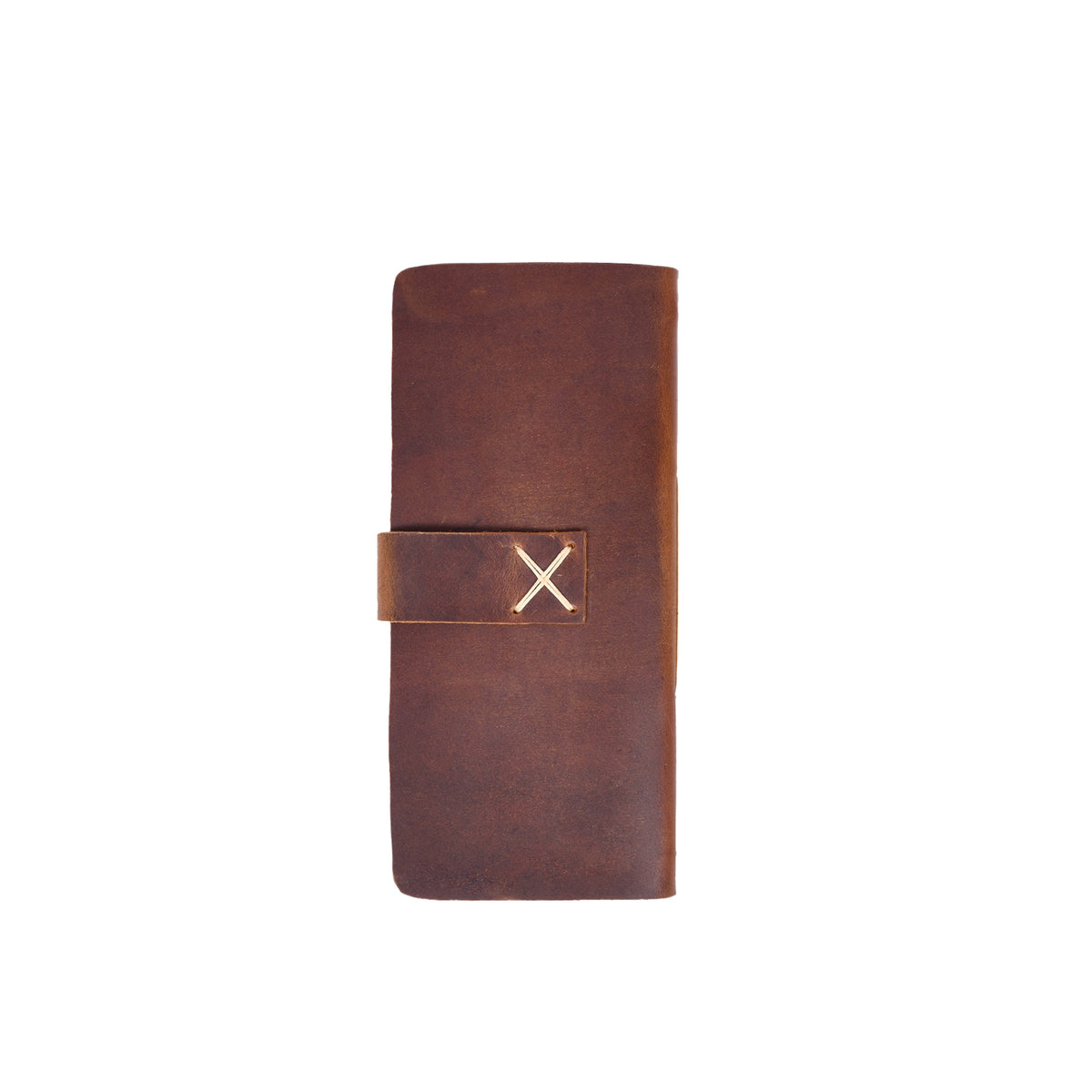 The GUNNER Hunting Log by GUNNER features a brown leather cover with a strap closure, secured by an X-shaped light stitch—crafted with the same attention to detail as fine hunting gear. Pictured on a white background.