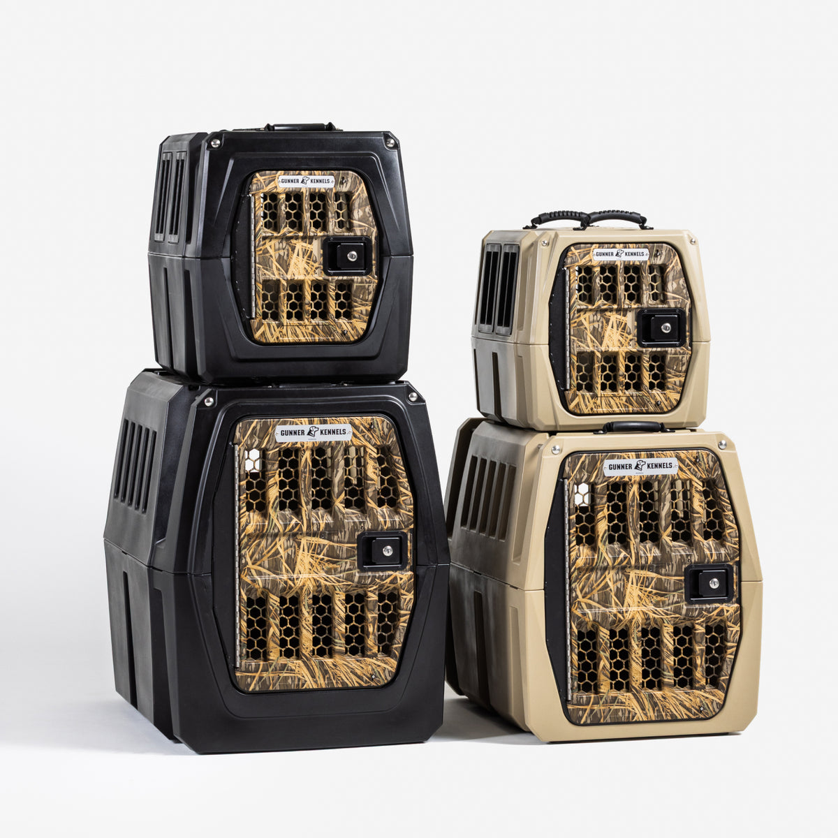 Four durable GUNNER G1™ KENNEL dog crates—two black and two tan Shadow Grass—are stacked against a white background, each featuring ventilated sides and camouflage-patterned doors for safety and style.