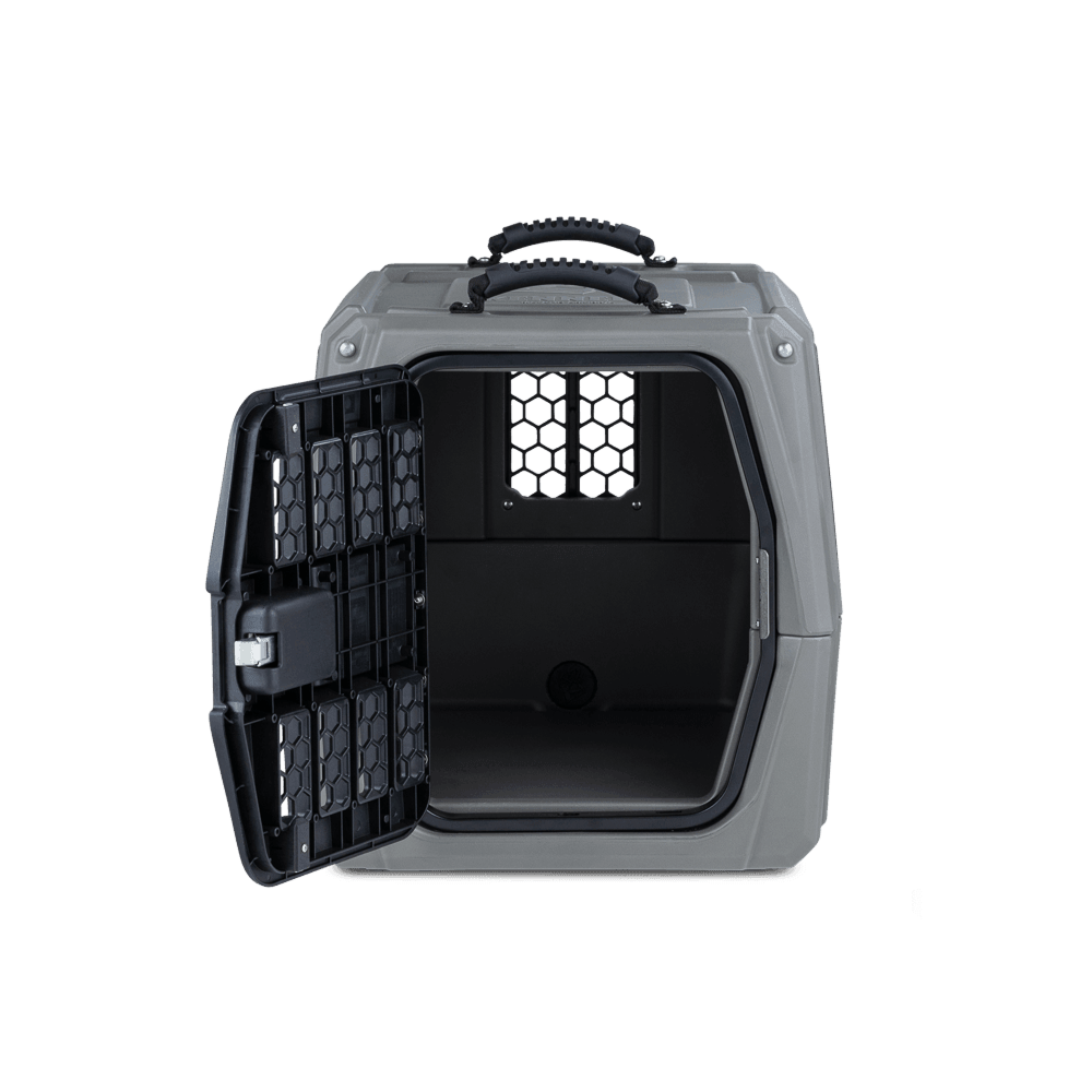 The GUNNER G1™ KENNEL in Gunmetal is shown with its black grated door open, revealing the empty, durable interior against a plain white background.