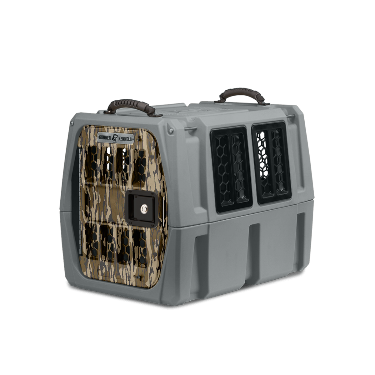 The GUNNER G1™ KENNEL - MOSSY OAK BOTTOMLAND GUNMETAL is a sturdy, gray plastic dog crate featuring a camo metal door, side ventilation windows, and brown top handles for safe animal transport.