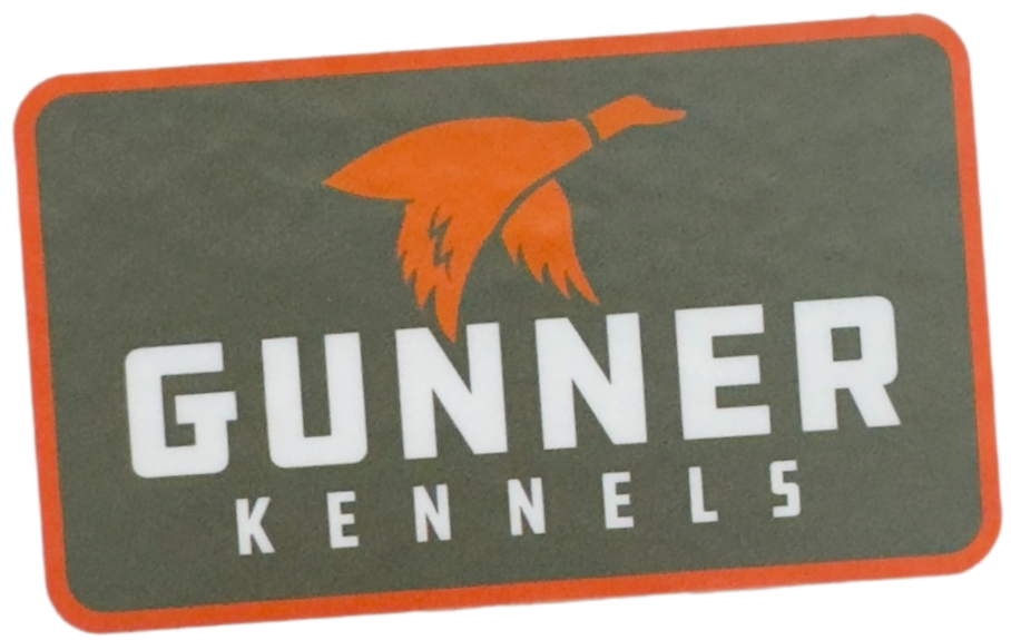 Rectangular logo with an orange flying duck silhouette above the bold white text GUNNER and smaller white text KENNELS below, perfect for a quality kennel or dog crate brand, on a dark gray background with an orange border.