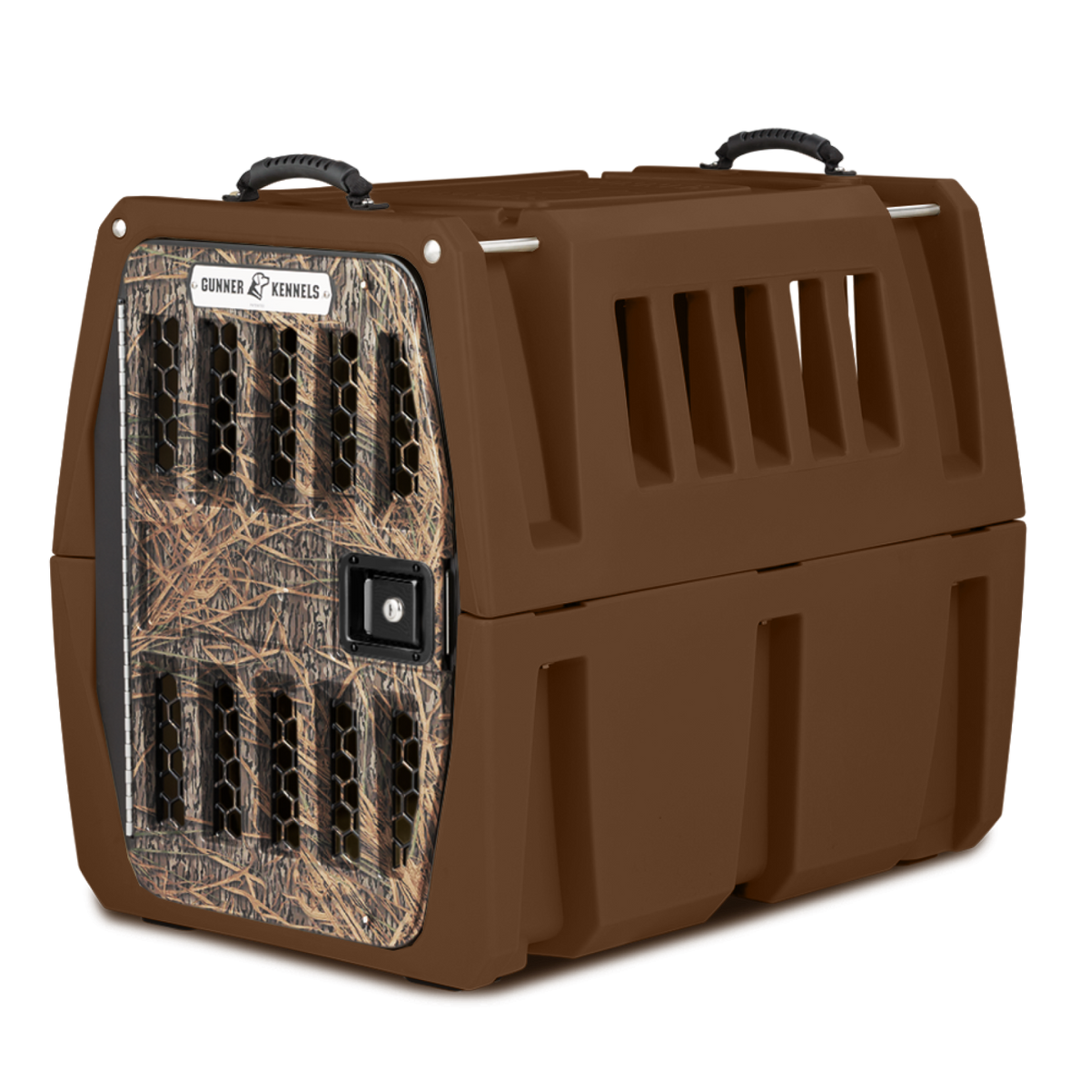 The GUNNER G1™ KENNEL - SUSQUEHANNA/MOSSY OAK SHADOW GRASS is a hard-sided brown dog crate with ventilation slots, Mossy Oak-patterned door, sturdy top handles, and secure latch—ideal for safely transporting pets for duck & goose hunters.