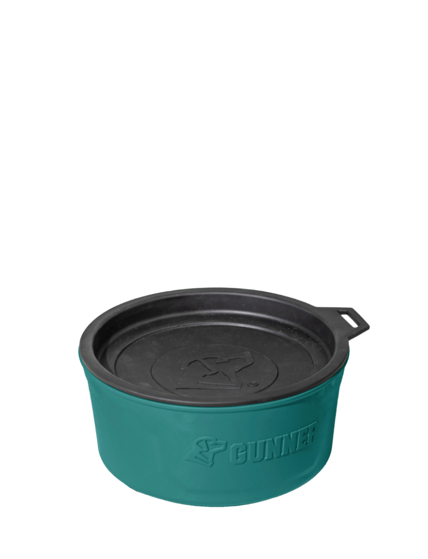 A teal-colored, round pet bowl with a black lid and handle, featuring the Gunner logo embossed on the side. Designed for use in your dog kennel, the bowl appears to be made of durable material and is set against a plain white background.