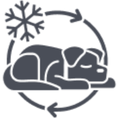 A graphic of a working dog curled up and sleeping inside a circular arrow, with a snowflake symbol above, indicating cold weather or winter.